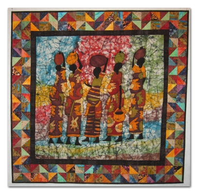 A friend went on a mission trip to Rwanda. Knowing my love for fabric, she brought back this beautiful batik which serves as the centerpiece. I added the borders and quilted it. I call this piece Compassion since she was on a trip with the Christian humanitarian organization called Compassion International.